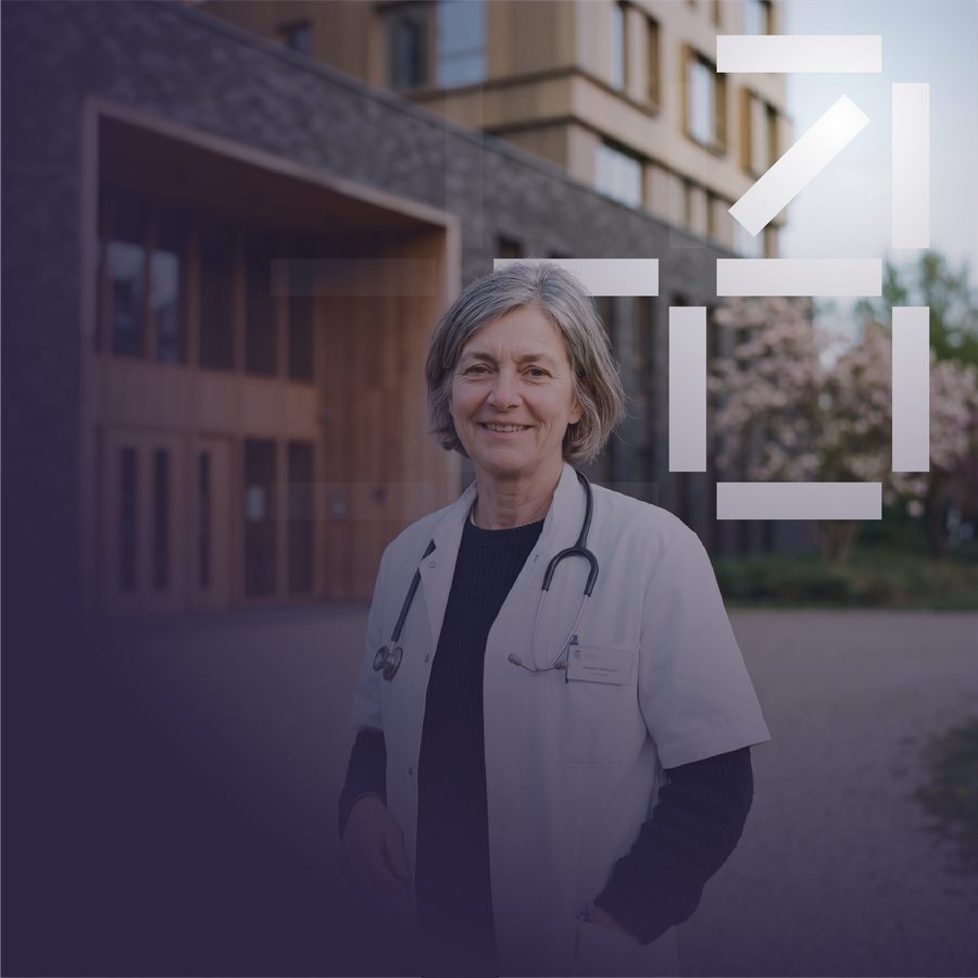 A doctor outside a modern care building